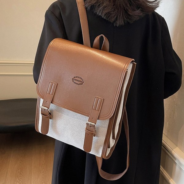 A fashionable autumn and winter new large-capacity backpack with contrasting colors, a versatile student schoolbag, and a retro color-blocked commuting backpack details Picture