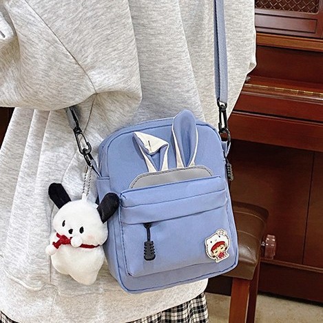 A new Korean-style cute rabbit-ear backpack for primary school students, suitable for both men and women, and a Japanese-style cute crossbody bag for young girls Application Scenario