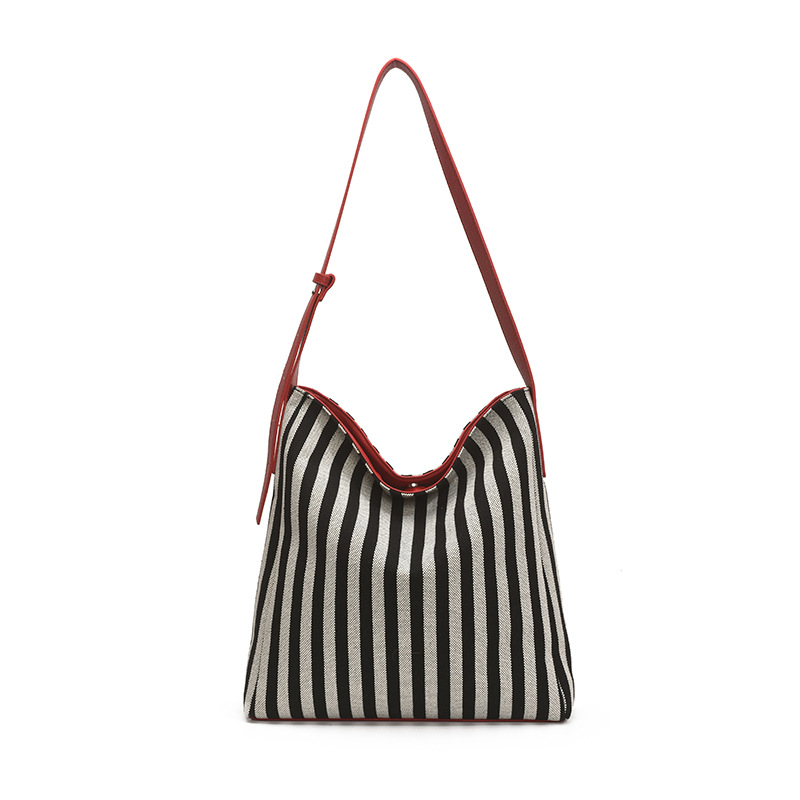 2025 Large-capacity fashionable single-shoulder women's striped fabric bag, new style for laid-back commuting, stylish color-blocking bucket bag Item Picture