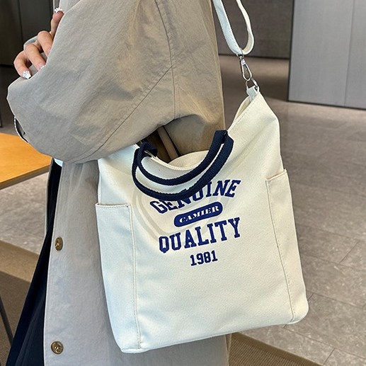 Canvas backpack bag, cotton letter casual hand-held bag, printed cosmetics and accessories, new cotton canvas bag Application Scenario