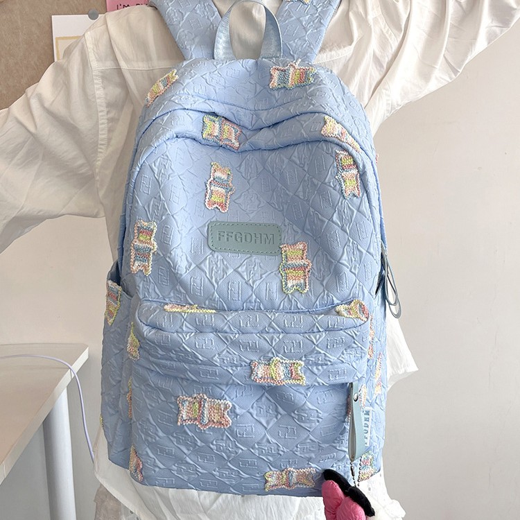 New large-capacity student backpack with diamond-patterned pleats for primary, junior high and senior high school students. Cute little bear backpack details Picture