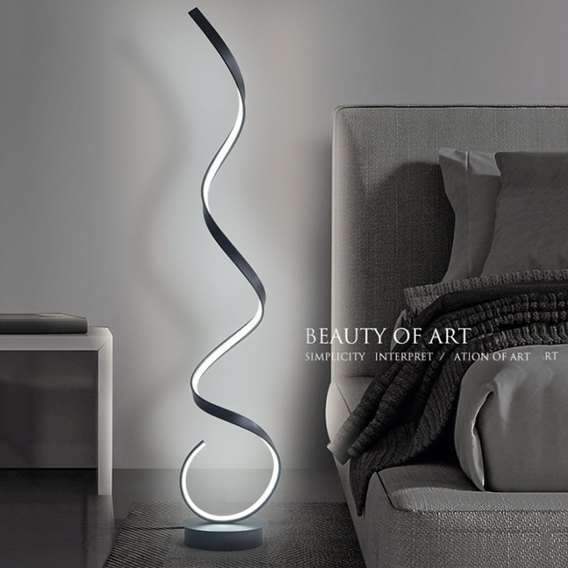 The floor lamp with a full-spectrum minimalist design sense is a popular corner wavy atmosphere line lamp beside the sofa in the Nordic living room full figure