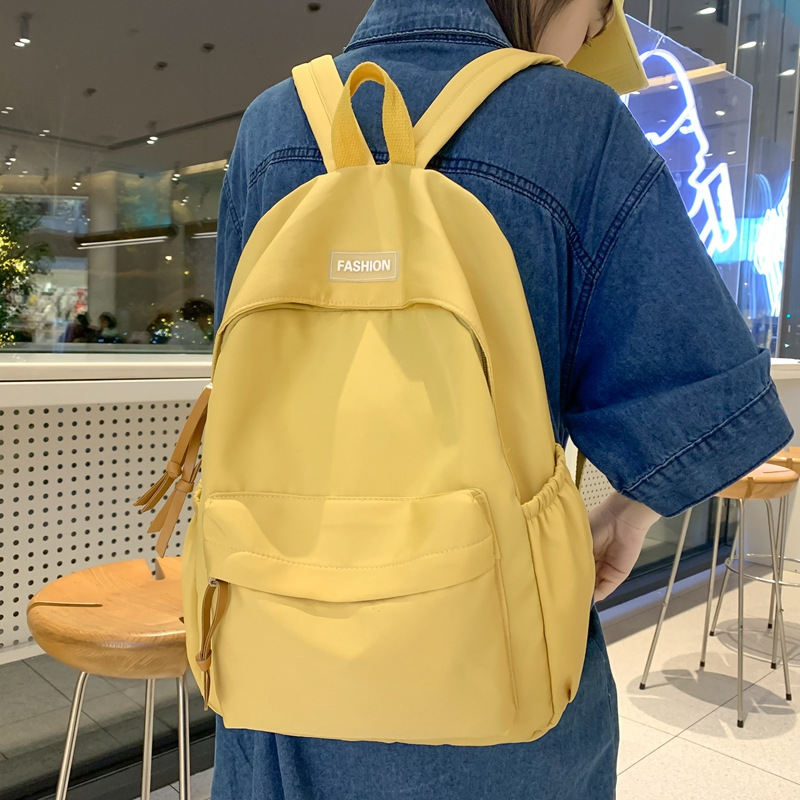 Wholesale of new solid-color backpacks, Korean version of ins schoolbags for junior high school, senior high school and college students, and large-capacity backpacks for leisure travel details Picture