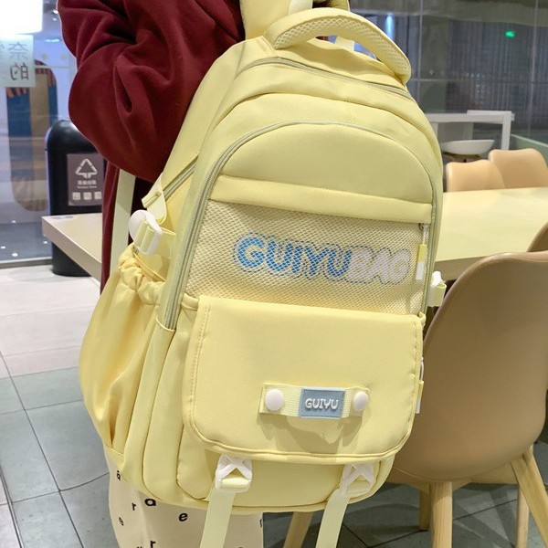 The new schoolbag is simple and versatile for female middle school students. It features a large-capacity, fashionable solid color backpack and a college-style backpack for high school students details Picture