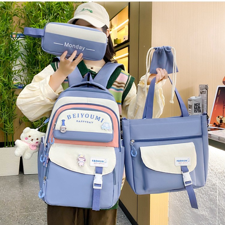 Four-piece Korean-style Instagram schoolbag for girls, a cute and fresh backpack with contrasting colors, large capacity and spliced for junior high school students full figure