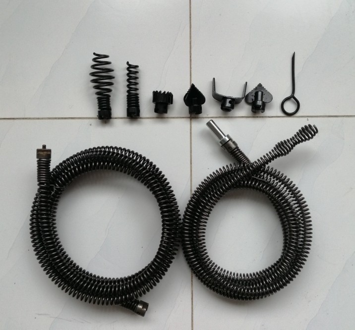A household sewer unclogging tool, a hand drill, 12mm spring for unclogging pipes undefined