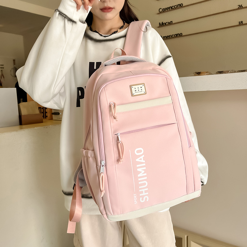 Large-capacity schoolbag for girls, simple and solid-color Japanese-style junior high school student backpack, wide shoulder strap backrest, casual backpack wholesale full figure