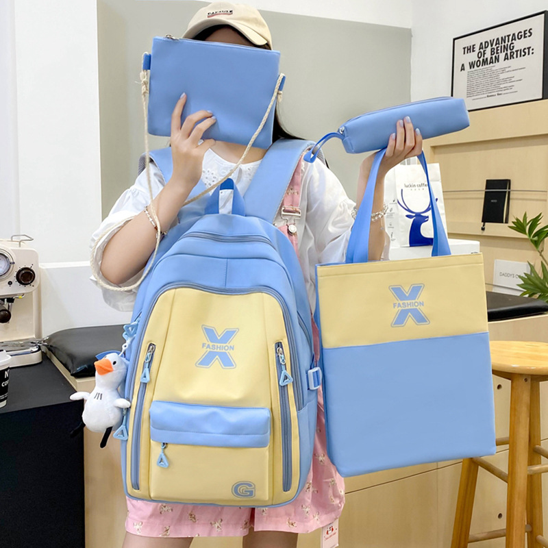 The new girls' schoolbag is versatile. It features a large-capacity campus backpack for junior high school students with contrasting colors and a lightweight tutorial backpack set of four pieces full figure