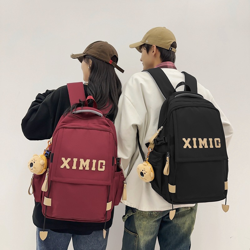 The new schoolbag is a trendy and cool casual backpack for middle school girls, a couple's backpack for college students, and a two-piece set for primary school students full figure