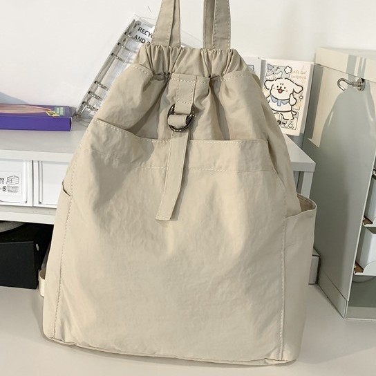 New cross-border lightweight hand-held fabric bag, artistic girl's shrink backpack, casual, exquisite, trendy and versatile handbag Application Scenario