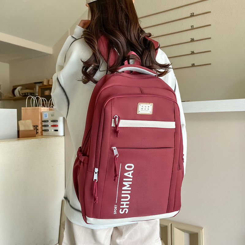 Large-capacity schoolbag for girls, simple and solid-color Japanese-style junior high school student backpack, wide shoulder strap backrest, casual backpack wholesale details Picture