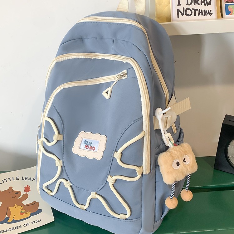 The 2024 new color-blocking creative backpack is a versatile and casual backpack for college students and a casual schoolbag for junior and senior high school students full figure