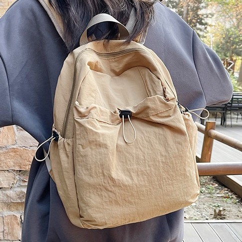 Korean version large-capacity backpack for women, fashionable and lightweight multi-layer travel backpack, women's nylon ultra-light waterproof travel schoolbag full figure