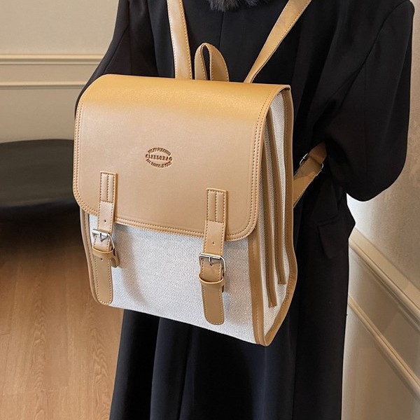 A fashionable autumn and winter new large-capacity backpack with contrasting colors, a versatile student schoolbag, and a retro color-blocked commuting backpack full figure
