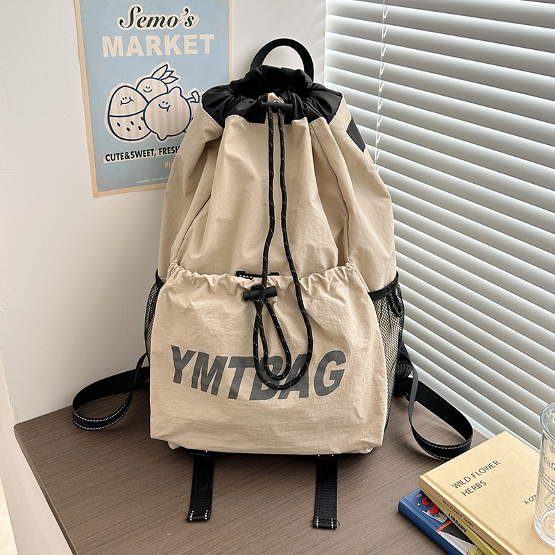 Korean-style outdoor sports, mountain climbing and travel, niche lightweight backpack, drawstring opening, simple and casual student backpack for women Application Scenario