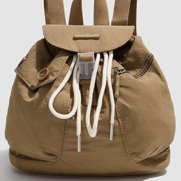 2024 New Korean ins women's niche design lightweight pocket button drawstring backpack with multiple pockets Specification drawing