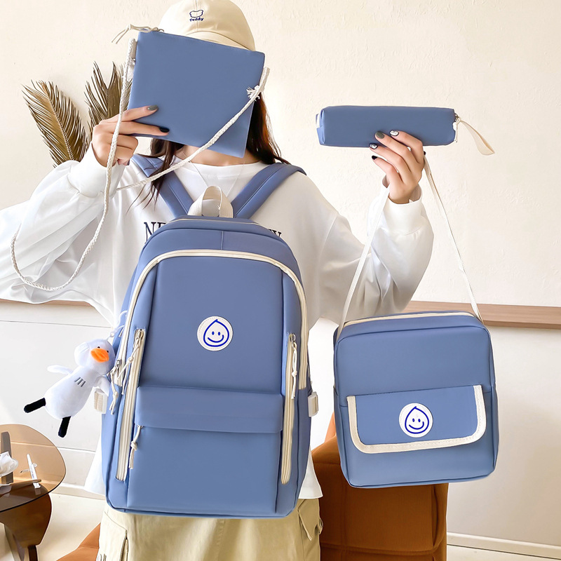 A new four-piece set of schoolbag for foreign trade, a simple and solid Korean-style forest-themed backpack with a large capacity and a fresh look for women details Picture