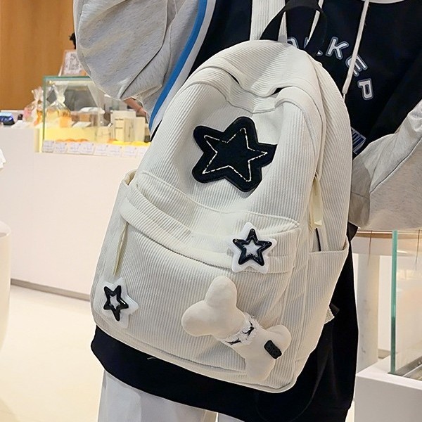 The new schoolbag is cute with star-shaped bones. It has a high appearance level and a niche design sense. It is a lightweight backpack and a school backpack for middle school students full figure