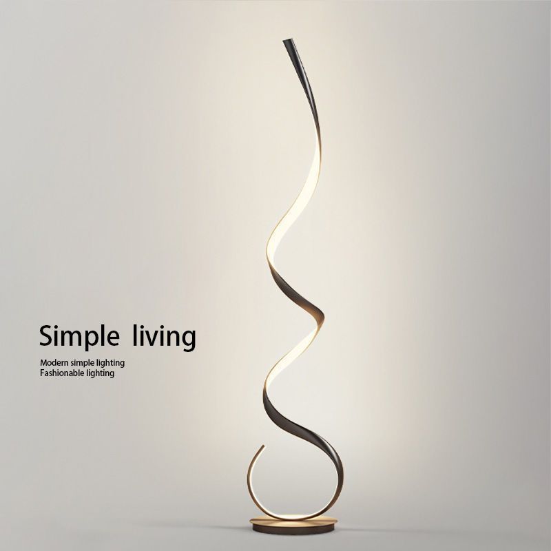 The floor lamp with a full-spectrum minimalist design sense is a popular corner wavy atmosphere line lamp beside the sofa in the Nordic living room details Picture