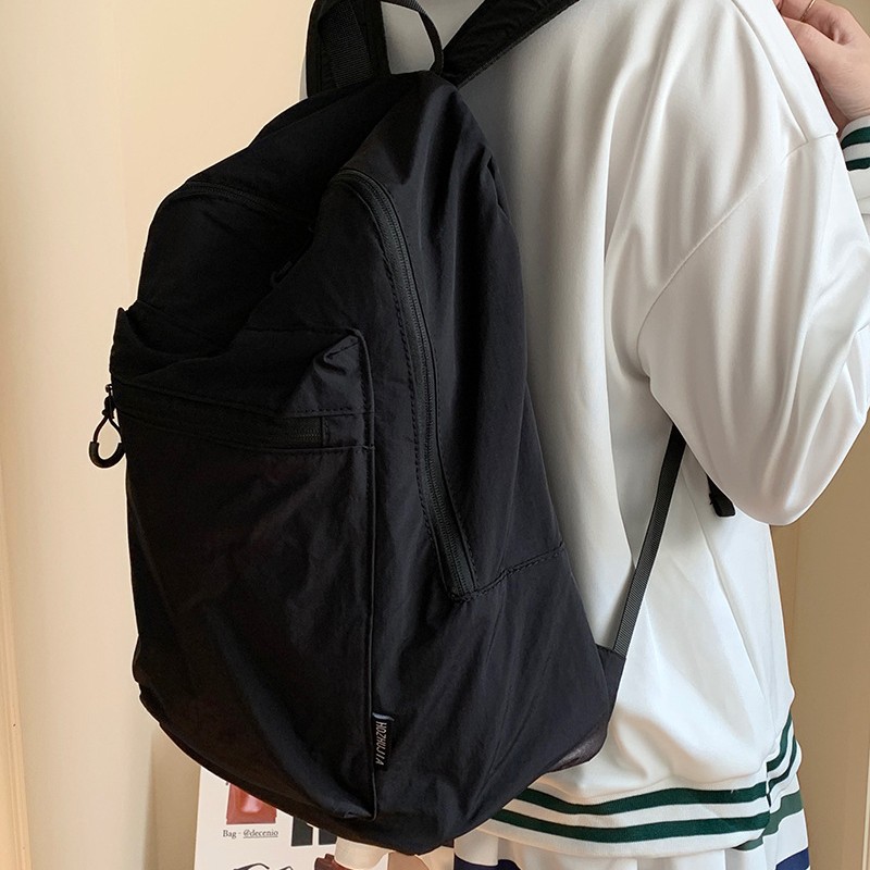This is a large-capacity, solid-color, waterproof, lightweight and versatile new autumn and winter casual backpack for students full figure