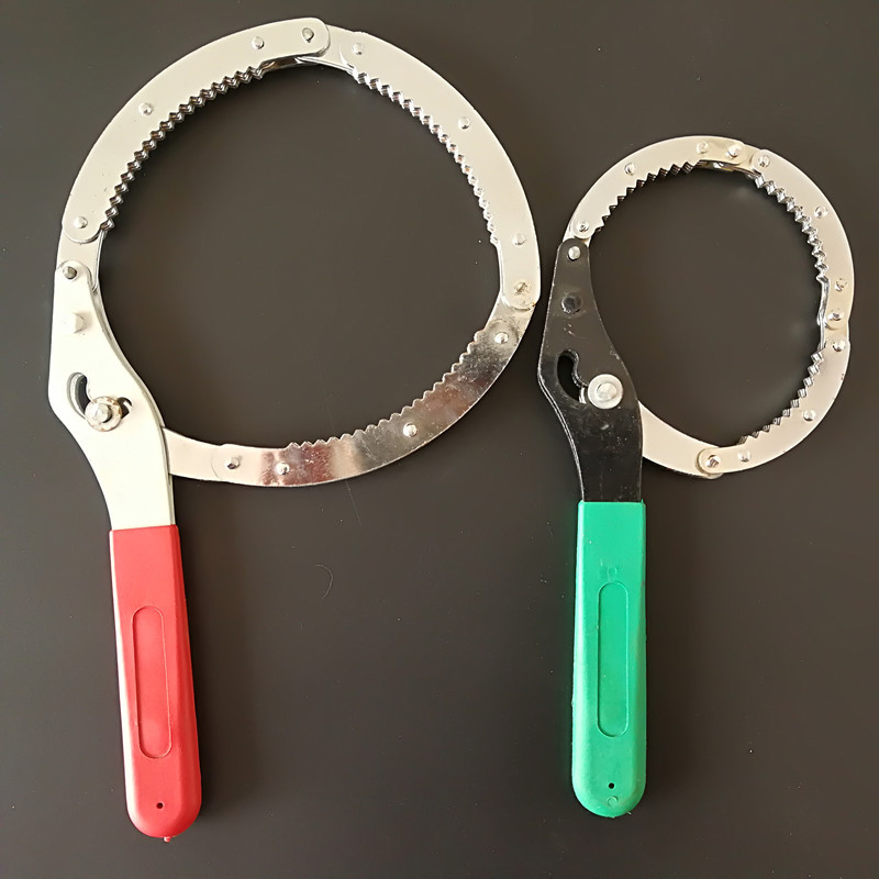 The stainless steel plate hand-held wrench is a universal tool for disassembling and assembling automotive oil filters undefined