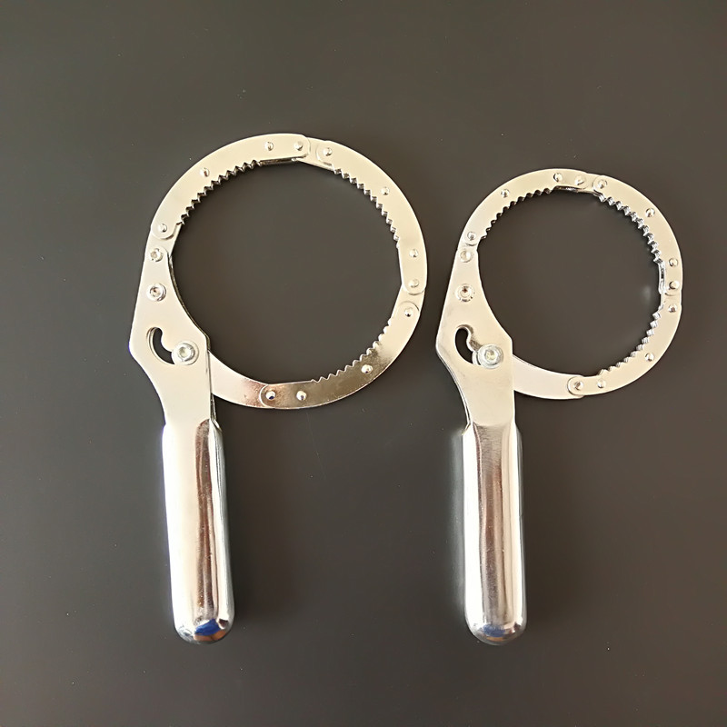 The stainless steel plate hand-held wrench is a universal tool for disassembling and assembling automotive oil filters undefined