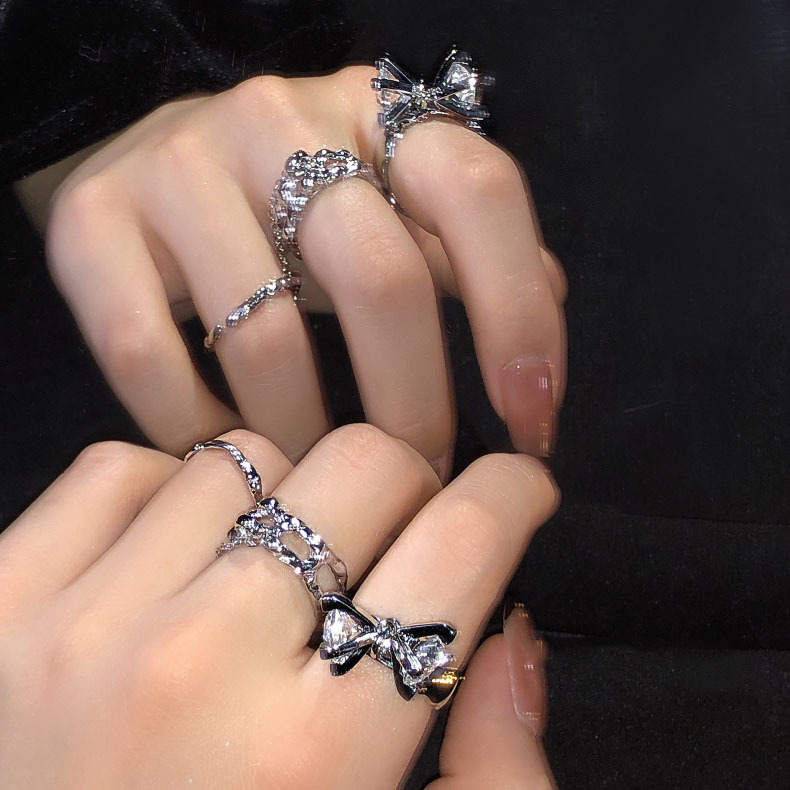 This is a niche design with a high-end and cold style. It features a double-diamond zircon open ring, a unique and fashionable chain ring for women full figure