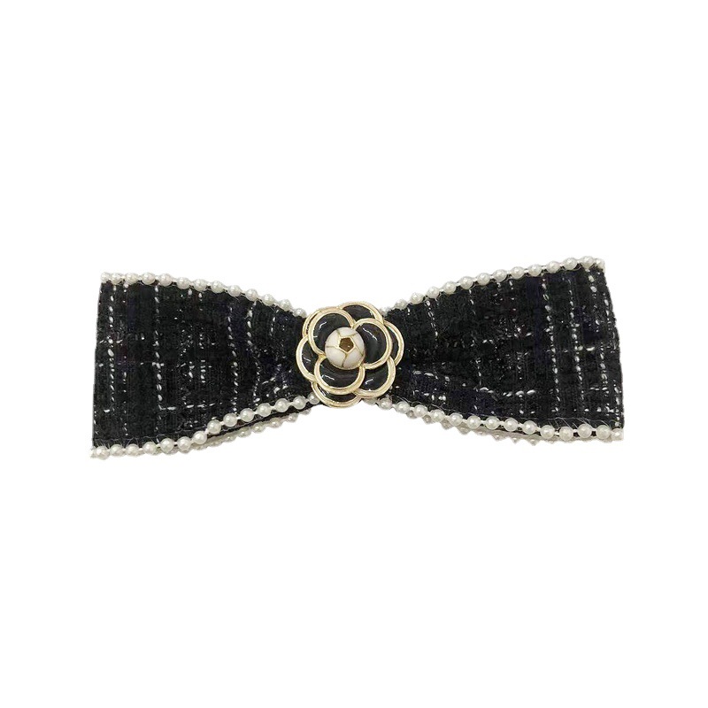 Korean camellia bow hairpin for women, a high-end hair accessory, a spring clip for the back of the head Item Picture