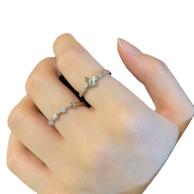 The micro-inlaid zircon heart-shaped butterfly opening ring is a fashionable and high-end design with a cold and aloof style for women. It is a niche and individual index finger ring Item Picture