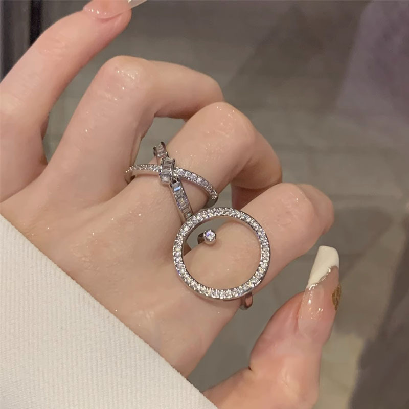 A new, trendy and cool fashion ring for a woman's Instagram, featuring multi-layered zirconia and an open-top design full figure