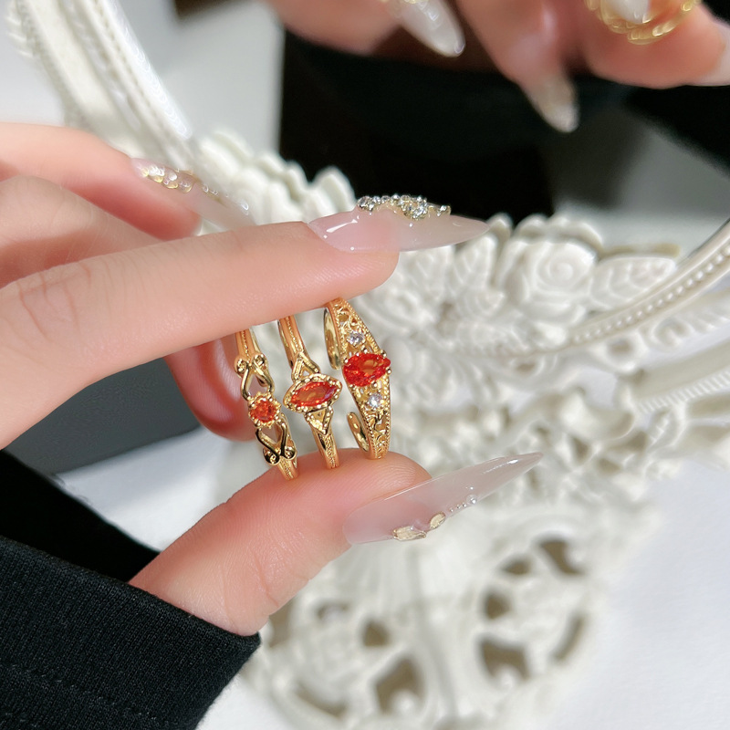 The new sweet and cool red diamond design with an open ring is fashionable, simple, luxurious and high-end. It's a trend of wearing multiple rings details Picture