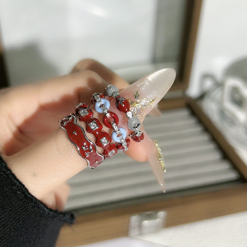 Korean Ankela red drip glaze fashionable niche ring for women, retro layering style, whitening and elegant exquisite index finger ring full figure
