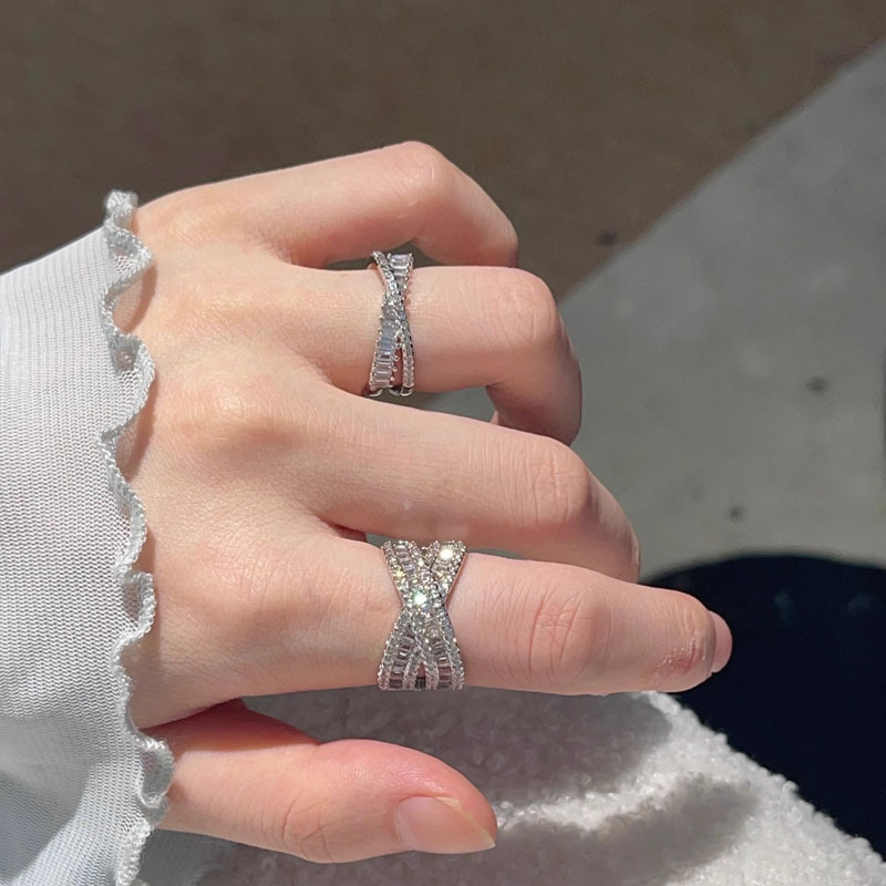 A high-end, light luxury, versatile full-diamond open ring for women on Instagram, with a cold style and geometric cross-layered design. It's a delicate food ring full figure
