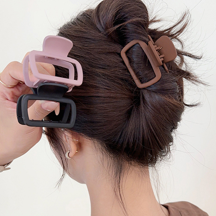 A new style of Korean minimalist square small hairpin with a half-tied hair at the back of the head, featuring a girl's hair clip, hair accessory and broken hair clip full figure