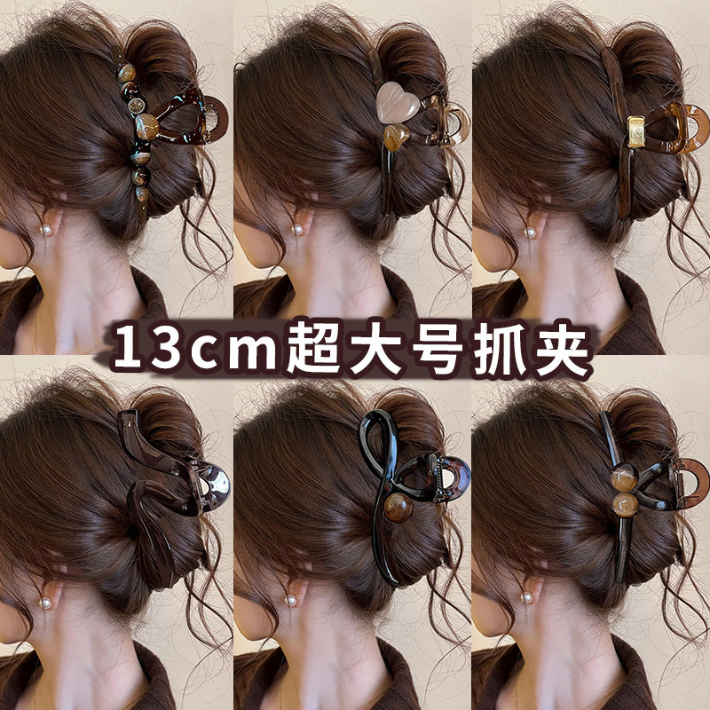 A large coffee-colored clipper for women, with a high-end look at the back of the head, a shark clip for thick hair, a stylish hairpin, and a headpiece full figure
