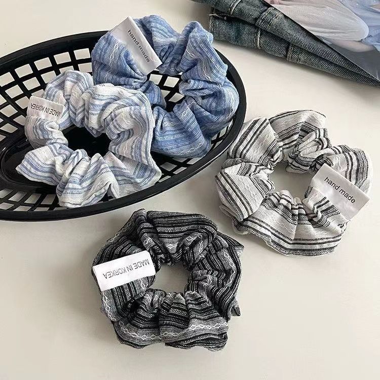 The gentle striped large intestine hair band exudes a high-end feminine charm. The loose, plain Korean-style bun hair band is elegant and refined Application Scenario