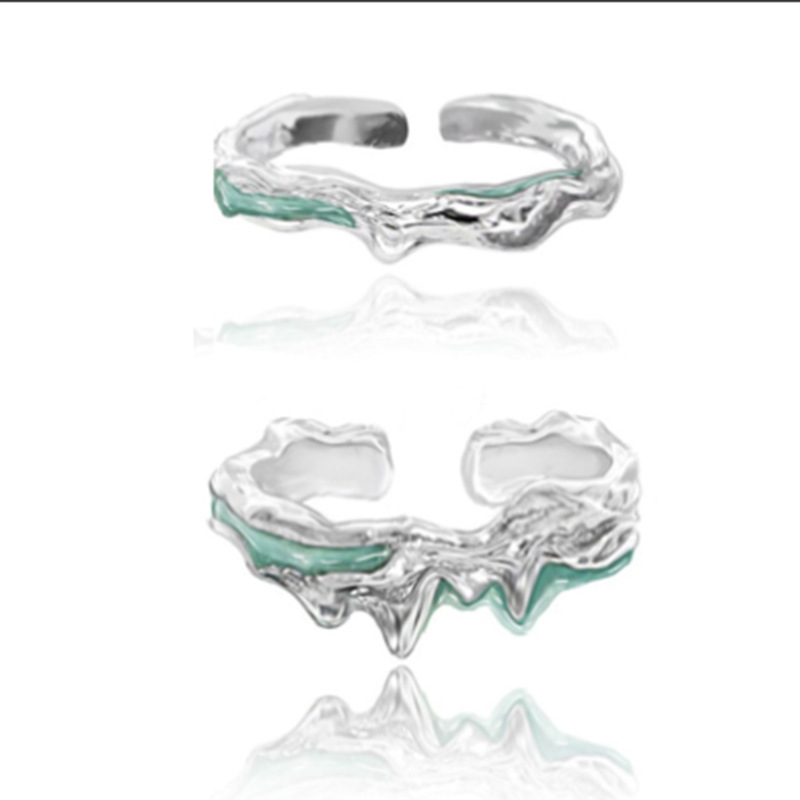 A mint-colored, lava textured rubber opening adjustable ring with a cold and elegant style for women, exuding a sense of fashion and sophistication. A new trend full figure