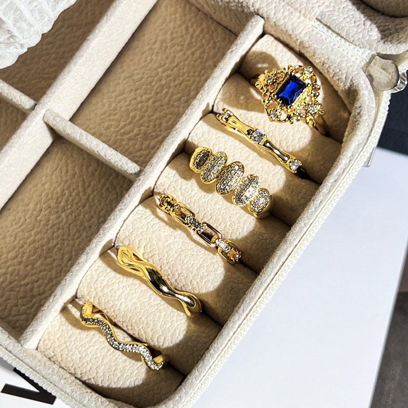 A trendy, slightly inlaid blue diamond lace open ring in the style of ancient Chinese coins, a simple and individual cold style index finger ring for women Application Scenario