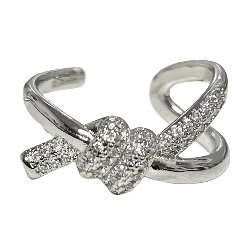This is a fashionable and exquisite index finger ring with a unique design sense, slightly inlaid lines, and a simple opening. It features a crossed knot and a cold style Item Picture