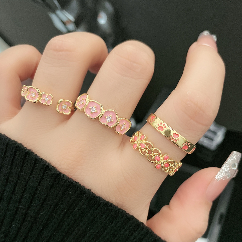 French-style hollowed-out flower glazed open ring, metal girl's niche retro cat paw simple and elegant ring Application Scenario