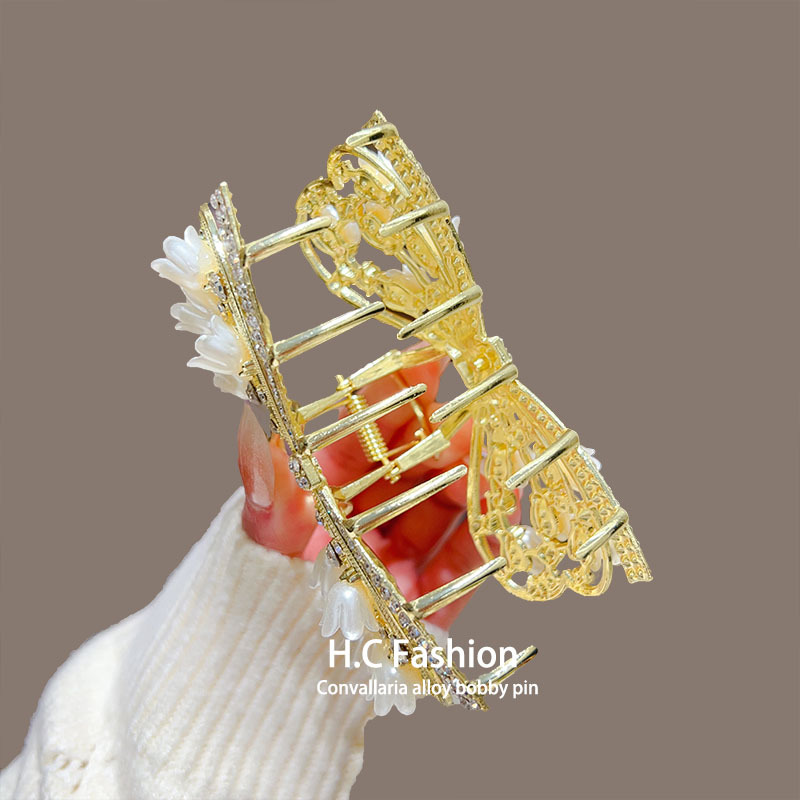The high-end bow lily of the valley claw clip is simple and versatile, with a delicate shark clip accessory on the back of the head Specification drawing