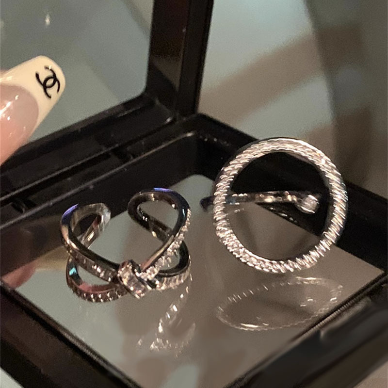 A new, trendy and cool fashion ring for a woman's Instagram, featuring multi-layered zirconia and an open-top design Application Scenario