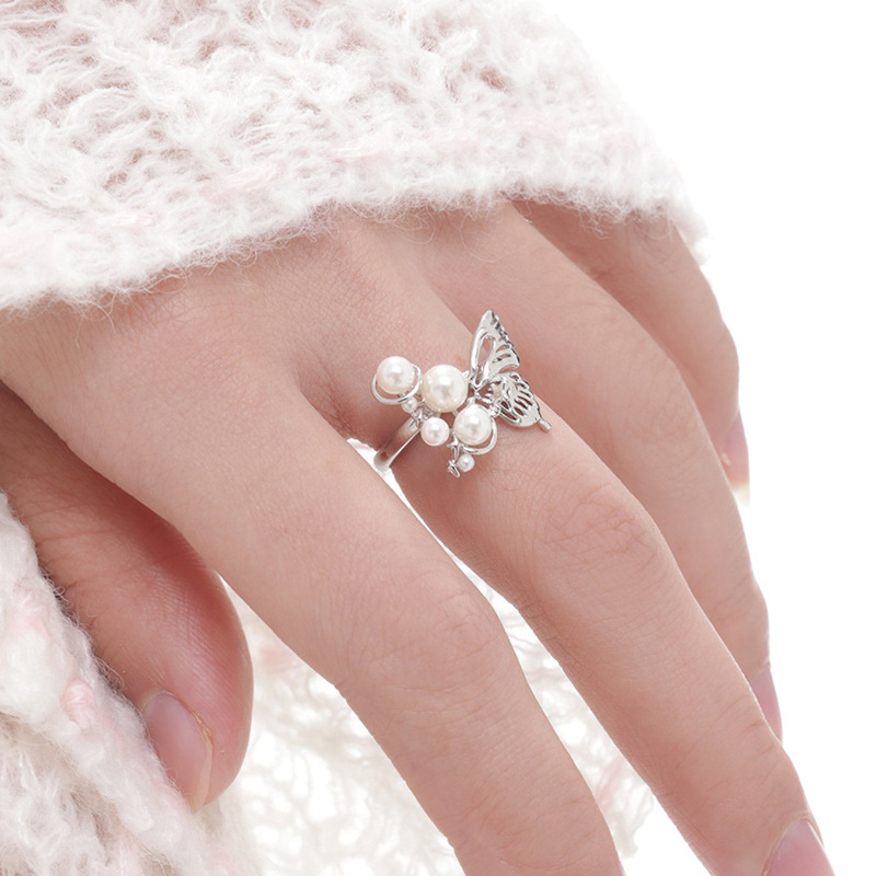 A simple and elegant three-dimensional planet pearl butterfly open ring, a niche design for women, with a unique and versatile style details Picture