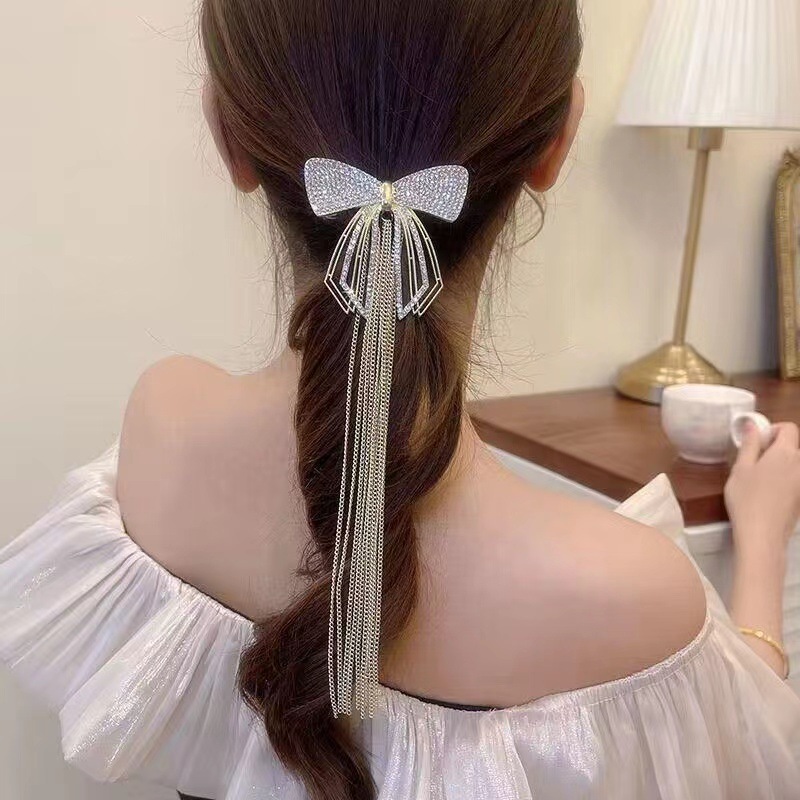 The new Korean-style bow chain tassel hair clip is super ethereal, individualistic, trendy, high-end and light luxury spring clip full figure