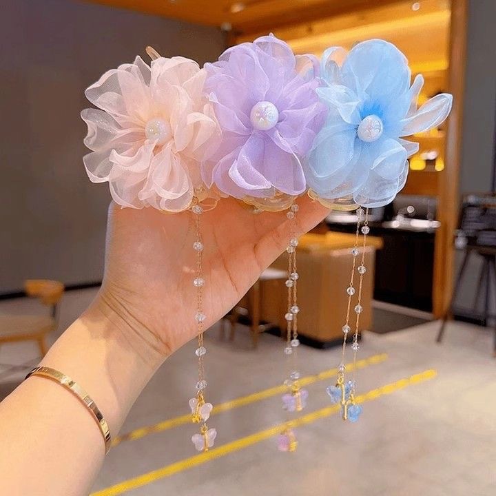 Sweet and popular children's bun hairstyle, sunflower tassel chain hair clip, super fairy-like children's updo hair clip, hair accessory details Picture