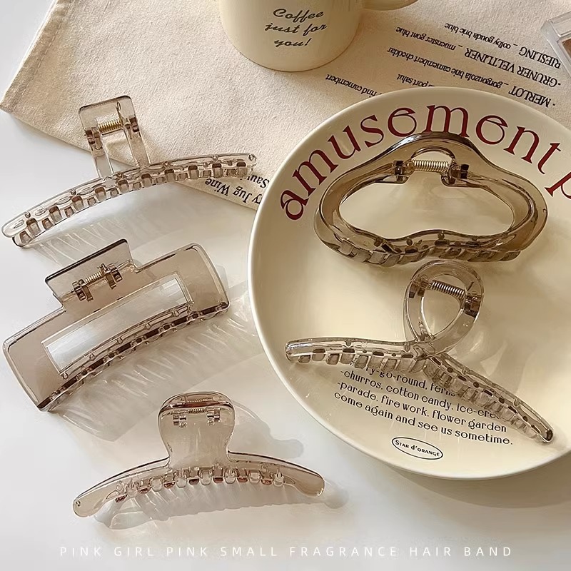 A new high-end Korean hair accessory with a transparent tea-gray color, featuring an extremely simple scratch-off clip and a stylish shark clip at the back of the head details Picture