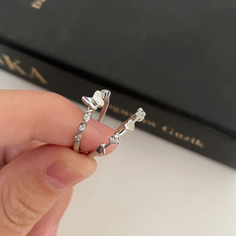 The micro-inlaid zircon heart-shaped butterfly opening ring is a fashionable and high-end design with a cold and aloof style for women. It is a niche and individual index finger ring details Picture