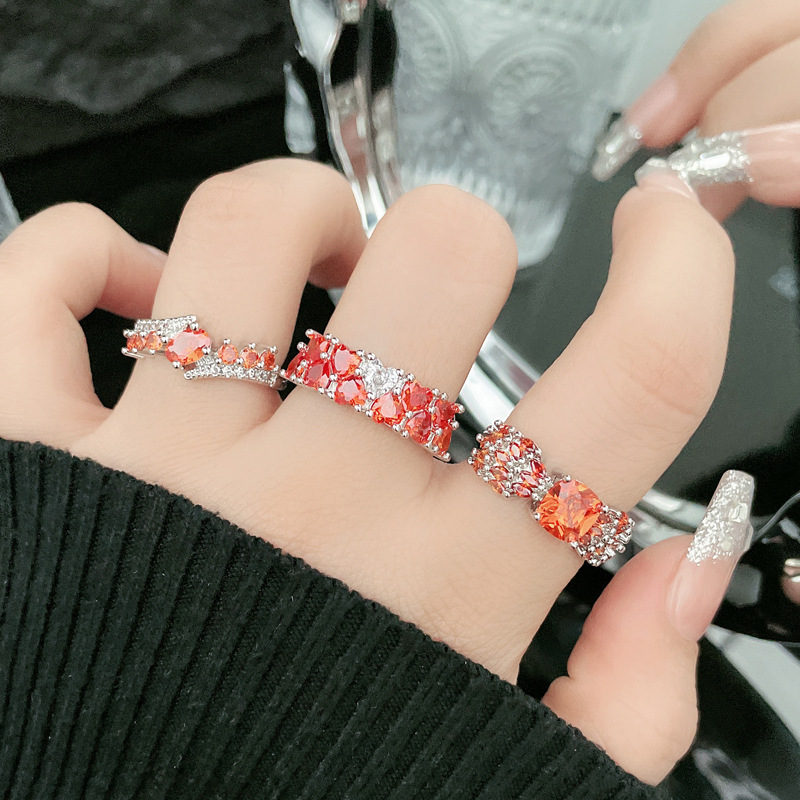 A new retro, niche, and sophisticated ring with a heart shape and full red diamonds, featuring a fashionable, light luxury, sweet and cool design full figure