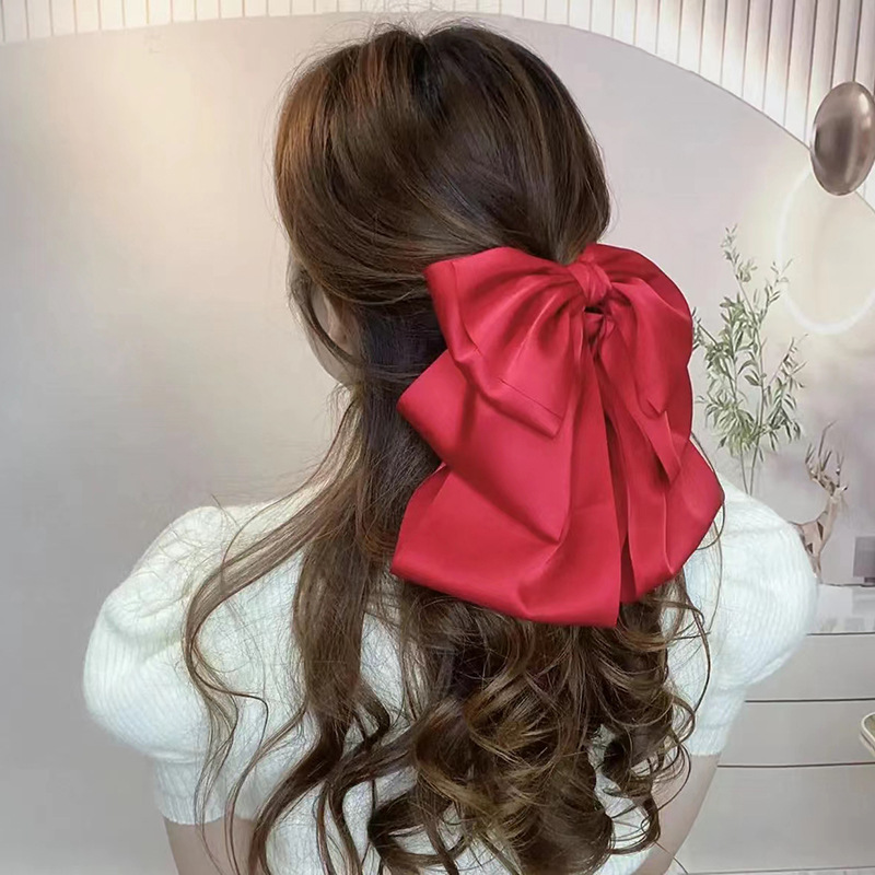 2025 New black bow hairpin with a flowing feel, a high-end Korean satin scratch-off hair accessory for the back of the head Application Scenario