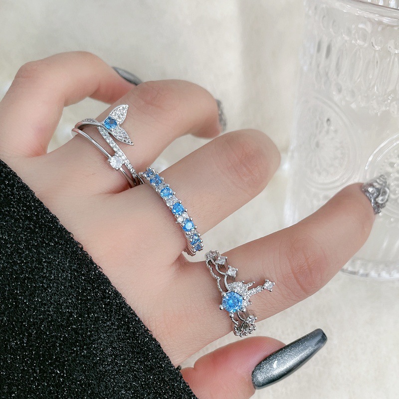 Aquamarine zircon crown with row of diamonds and open ring, a cool and stylish layering ring for women on Instagram, exuding a sweet and sophisticated vibe full figure
